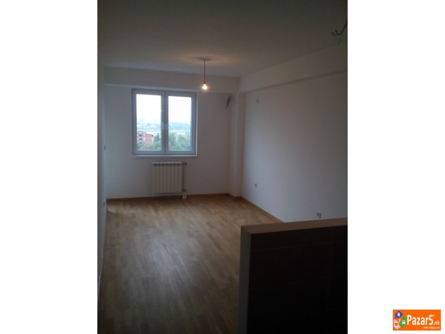 Се изнајмува нов неопремен стан  